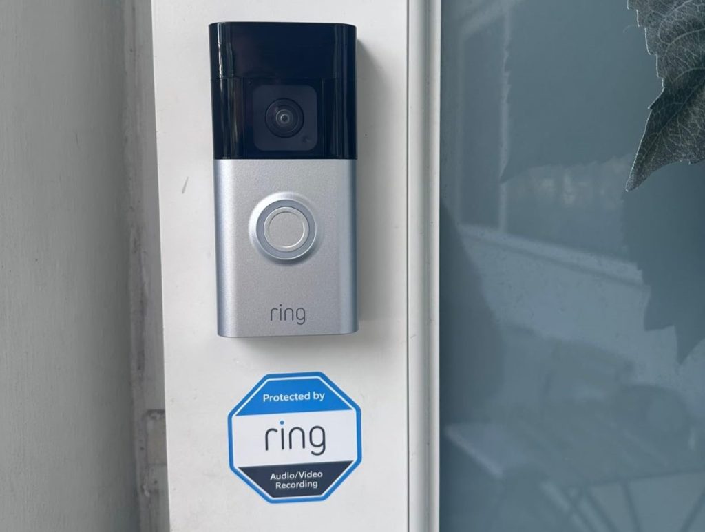 ring sticker near doorbell